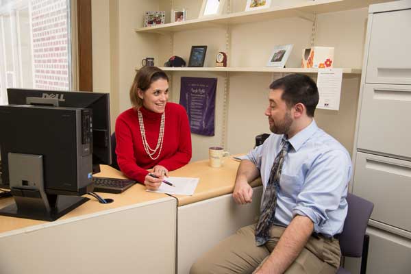 business student meeting with an academic advisor
